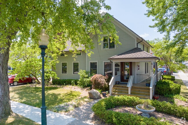 Downtown Rochester Victorian style home with a wraparound porch.