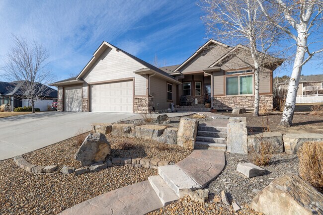 A craftsman-style home with rock landscaping in West Shiloh.