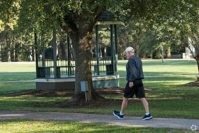 First Capitol Park features green spaces, walking paths, and benches for relaxation.