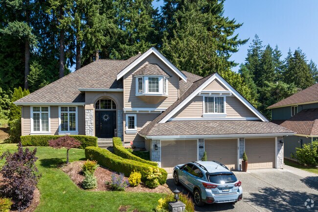 An elegant new traditional craftsman home Mill Creek East with a three-car garage.