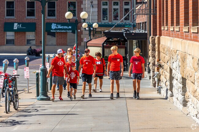 After home football games, fans celebrate along the streets of Haymarket near Irvingdale.