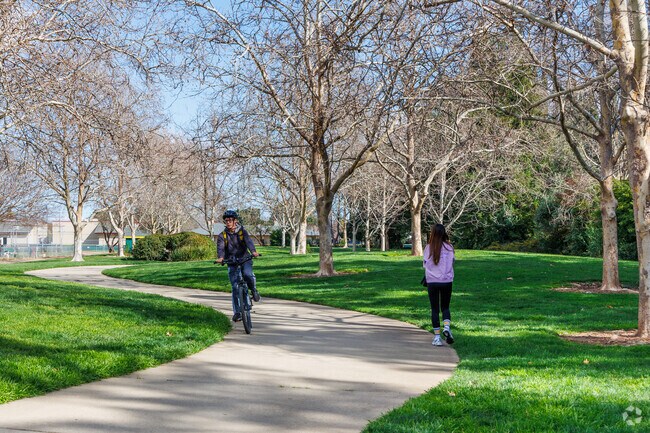 Sunset West locals enjoy walking and biking on the paved trails at Max Baer Park.