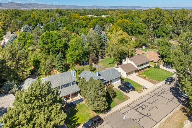 The mid 20th century homes of Stonehenge have large lots and mature shade trees.