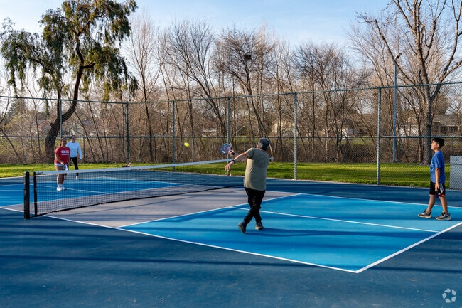 Family enjoys pickle bar for an afternoon activity together at Campus Park South.