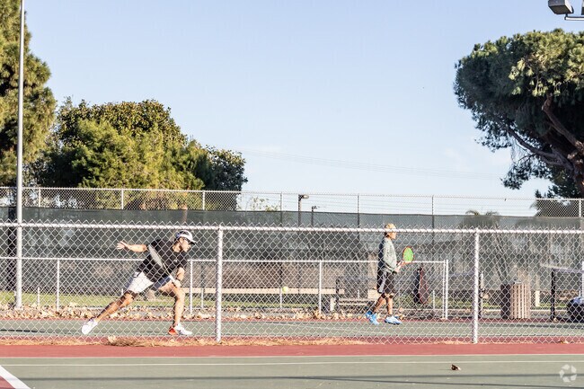 Locals in Westminster enjoy playing tennis outdoors at Bolsa Chica Park.