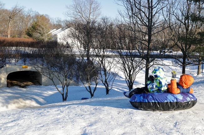Kids enjoy a snow day with their friends on a local hill in Broadlands.