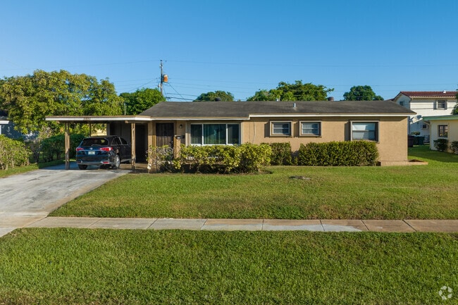 Small mid century ranch homes are previlent in the Broward Estates neighborhood in Ft Lauderdale