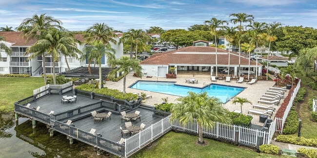 Building exterior with swimming poll and sitting area