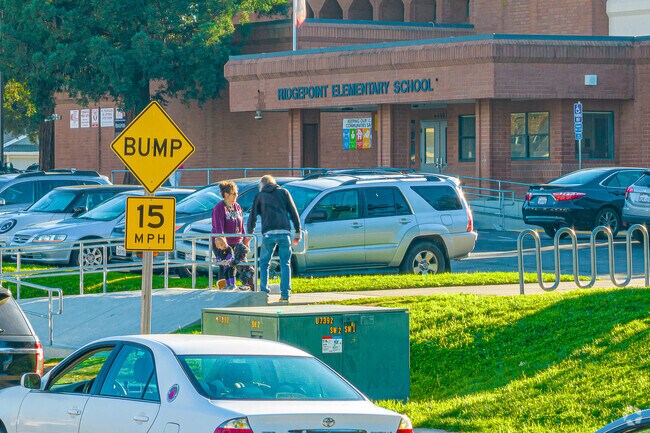 Families gather at pickup time Ridgepoint Elementary School.