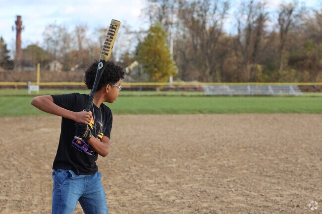 Kids enjoy the park activities in Upper Walnut Street.