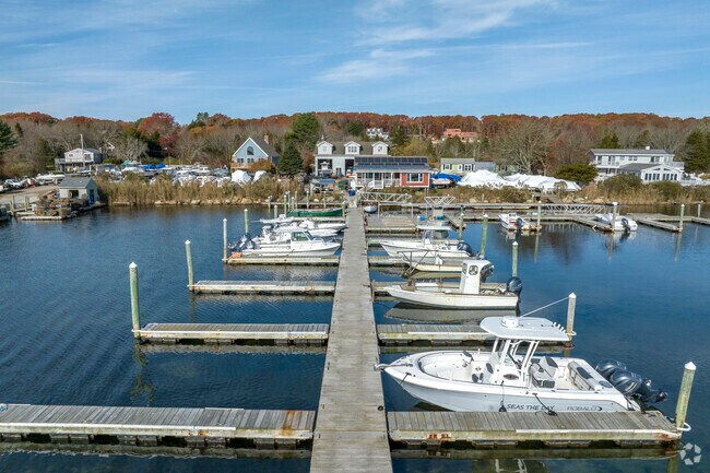 The marina at Ninigret Landing features dock slips for storage and ease of access.