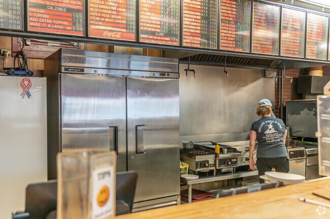 Village Pizza boasts a large menu of pizzas, subs, and pasta.