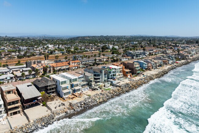 Large custom homes line the rocky beach in South Oceanside.