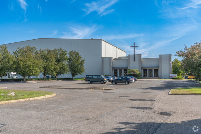 The main entrance and parking lot of Upper Room Christian School in Dix Hills.