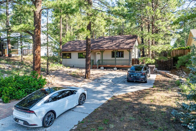 This cabin home is tucked away in the trees in Bow and Arrow Acres.