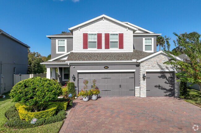 This beautiful two-story brick and stucco home in Beck Hammock boasts excellent accent colors.