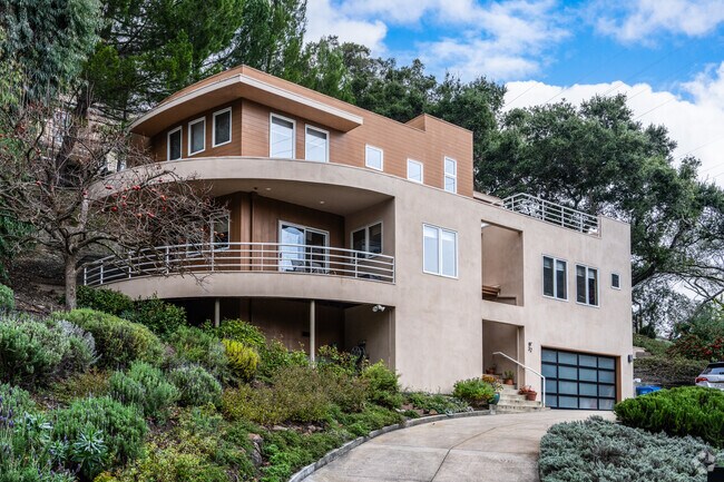 This contemporary home boasts open spaces and high-end finishes in Oak Springs.