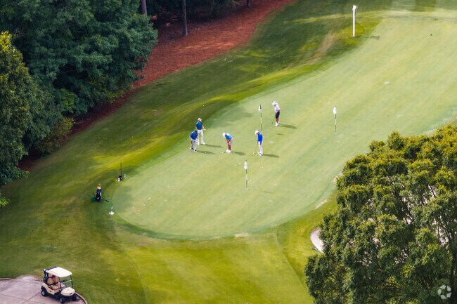 Golfers enjoy a morning round at the Cherokee Town and Country Club, the prestigious course at the heart of Huntcliff’s lifestyle.