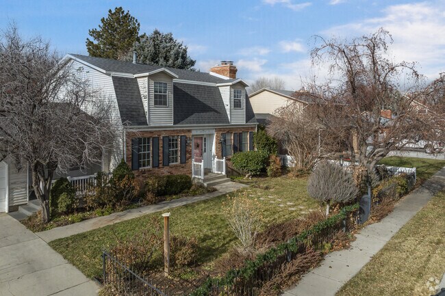 Unique homes with large front yards line this neighborhood street in Murray.