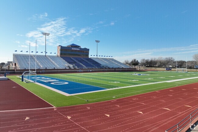 Joshua High School students play Friday night football at Owl Stadium.