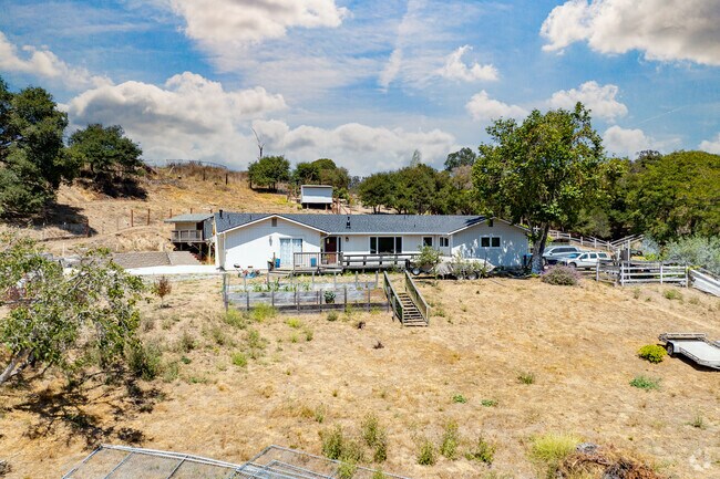 Ranch-style homes are a common architectural style in Aromas, often situated along forested hillsides.