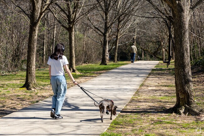 Locals resident take a walk through Glenlake Park.