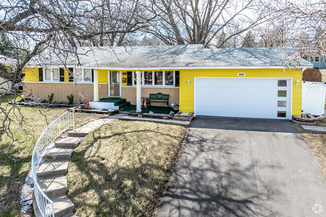 A yellow rambler style home in Winnetka Hills.