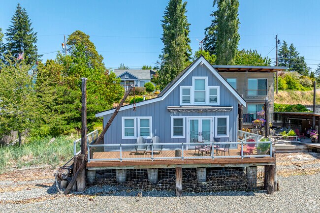 A charming beach bungalow sits along Manette's coastline.