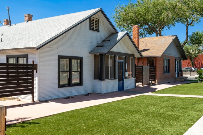 These historic homes in University Heights have been updated and feature a synthetic turf.