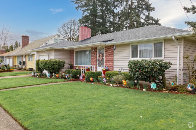 Lawn decorations add color and whimsy to this mid-century modern home in Mill Park.