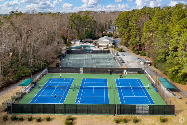 The Briarcliff Woods Beach Club is a private neighborhood swim and tennis club offering five tennis courts, a covered pavilion, and a large pool with diving boards.