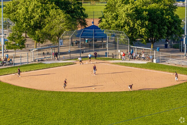 A men's softball league is a major attraction at Frontier Park near Tall Grass in Naperville.