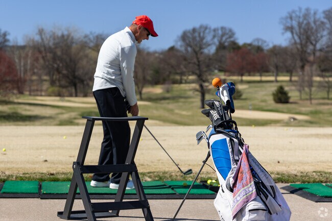 Golfers tee off at Forest Park Golf Course, located just north of Hi-Pointe.