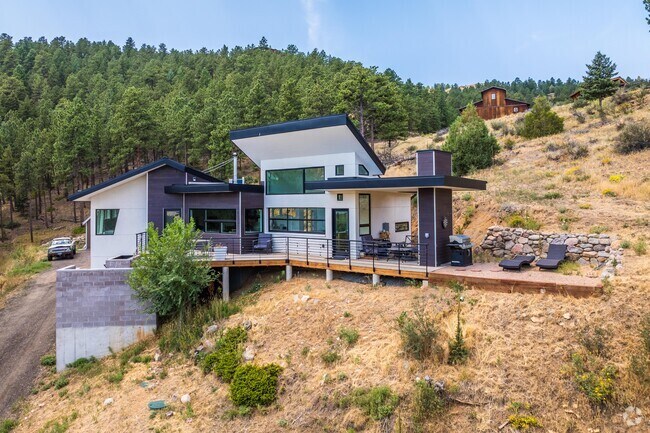 Some Crisman single family homes have modern features such as stone accents and front gables.