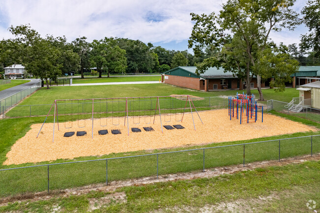 Students enjoy the swings at Anthony Elementary School in Marion County.
