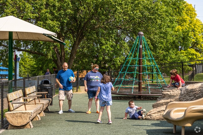 Randall parents take their kids to play on the playground at McCoy Park.