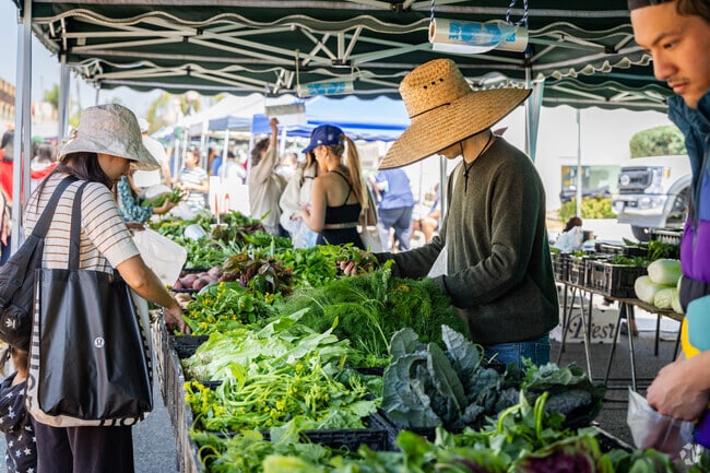 Airport Tract residents get to the Alhambra Farmers Market early for the freshest picks.