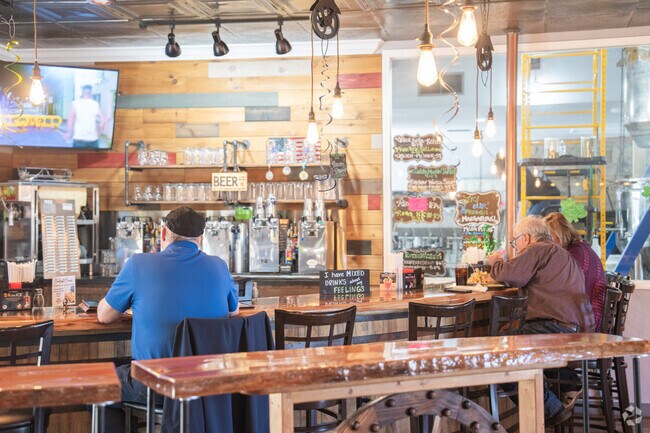 Grab a seat at the bar at the Sugar Hill Distillery and enjoy local beers.