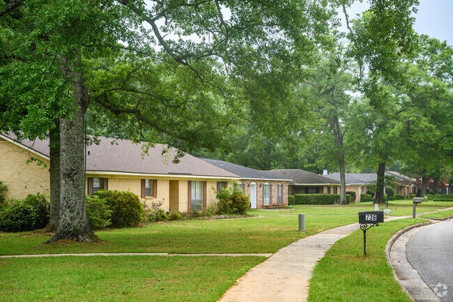 Sidewalk view of one story homes