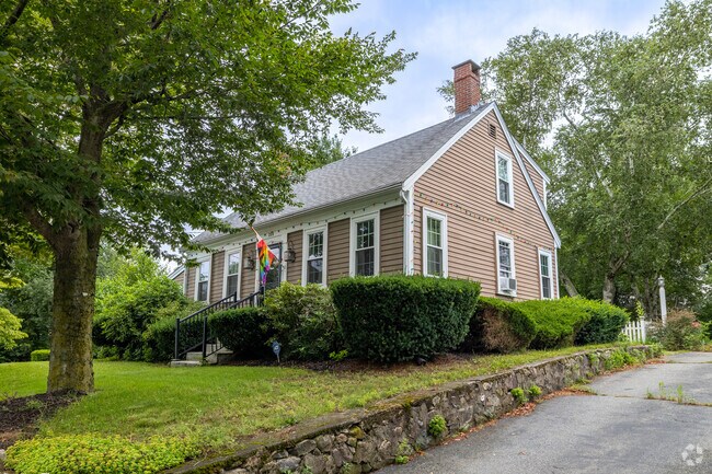 This Cape Cod in Randolph boasts a colorful flag on its front steps.
