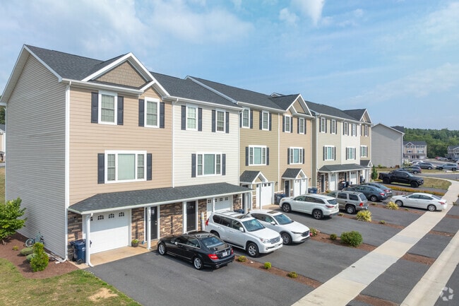 Contemporary townhouses with colonial-inspired facades can be found in Crossroads Farm.