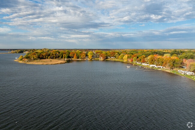 Coon Lake features sandy beaches, clear waters, and abundant wildlife near East Bethel.