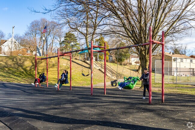 Kids love to swing at Bon Air Parklet in the heart of Bon Air.