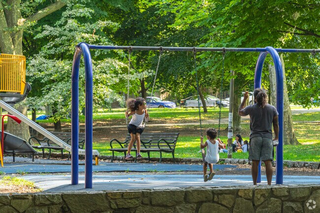 Tire out the tykes on the playground in Clark Park.