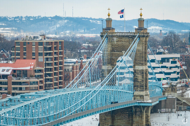 Covington residents cross the Roebling Bridge over the Ohio River for transportation.