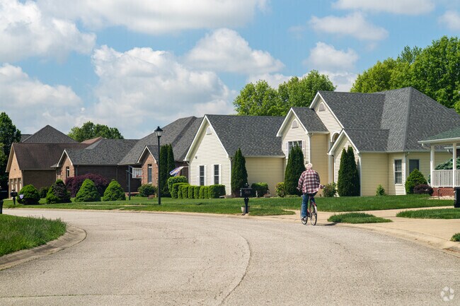 A resident of the Idle Creek Golf Community enjoys a bike ride through the neighborhood.