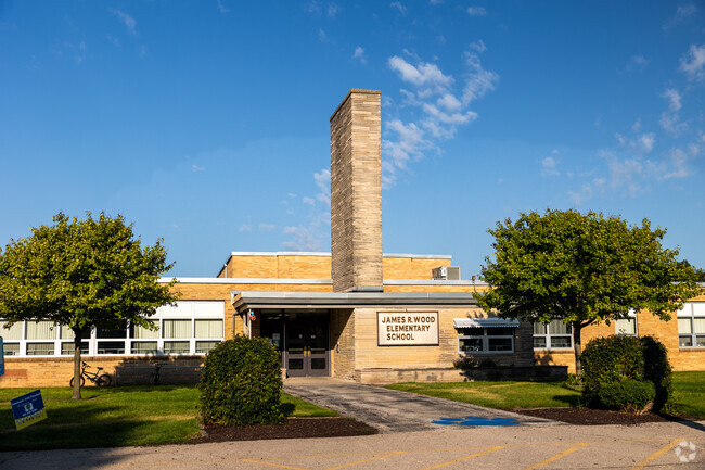 Welcome to James R Wood Elementary school featuring a unique exposed chimney.
