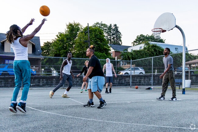 Locals in Oakhurst play basketball in a local park.