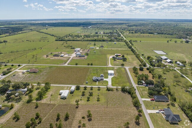 Wide tracts of land surround homes near Liverpool.
