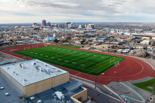 Pictured is Albuquerque High School's track and football field with downtown behind it.